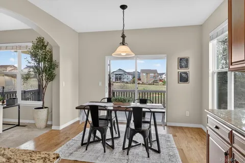 a dining room with furniture window wooden floor
