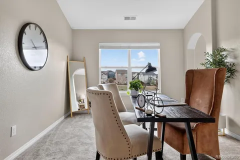 a living room with furniture and window