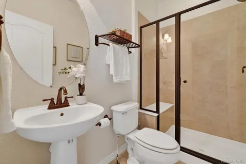 a balcony with furniture and a wooden floor