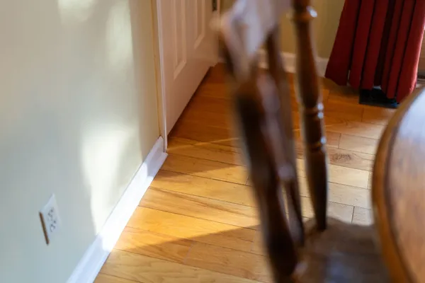 a kitchen with stainless steel appliances granite countertop a stove top oven a sink dishwasher a refrigerator and cabinets with wooden floor