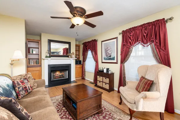 a living room with a fireplace and a fireplace