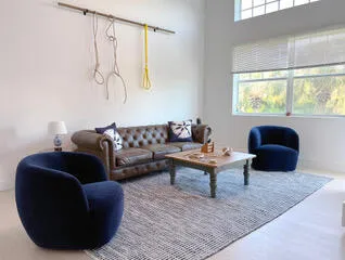 a living room with furniture and a window