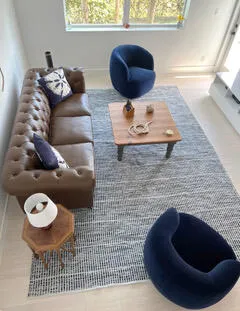 a living room with furniture and a table