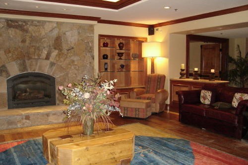 500 Village Road, Unit 302 Breckenridge, CO 80424 - Photo 11 of 13 a living room with furniture and wooden floor