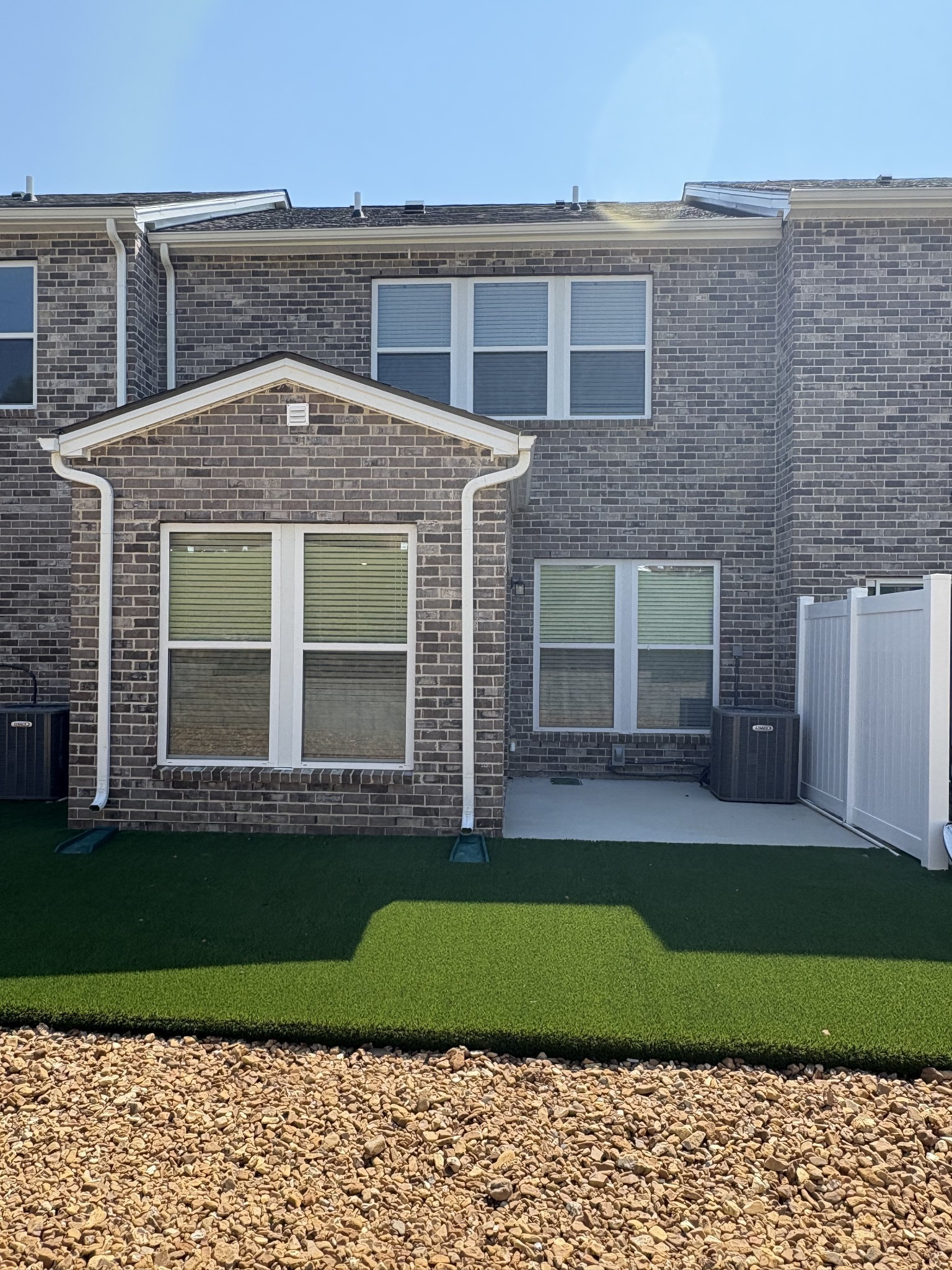 7144 Mapleside Lane, Unit 19 Fairview, TN 37062 - Photo 17 of 26 a front view of a house with a garden and yard