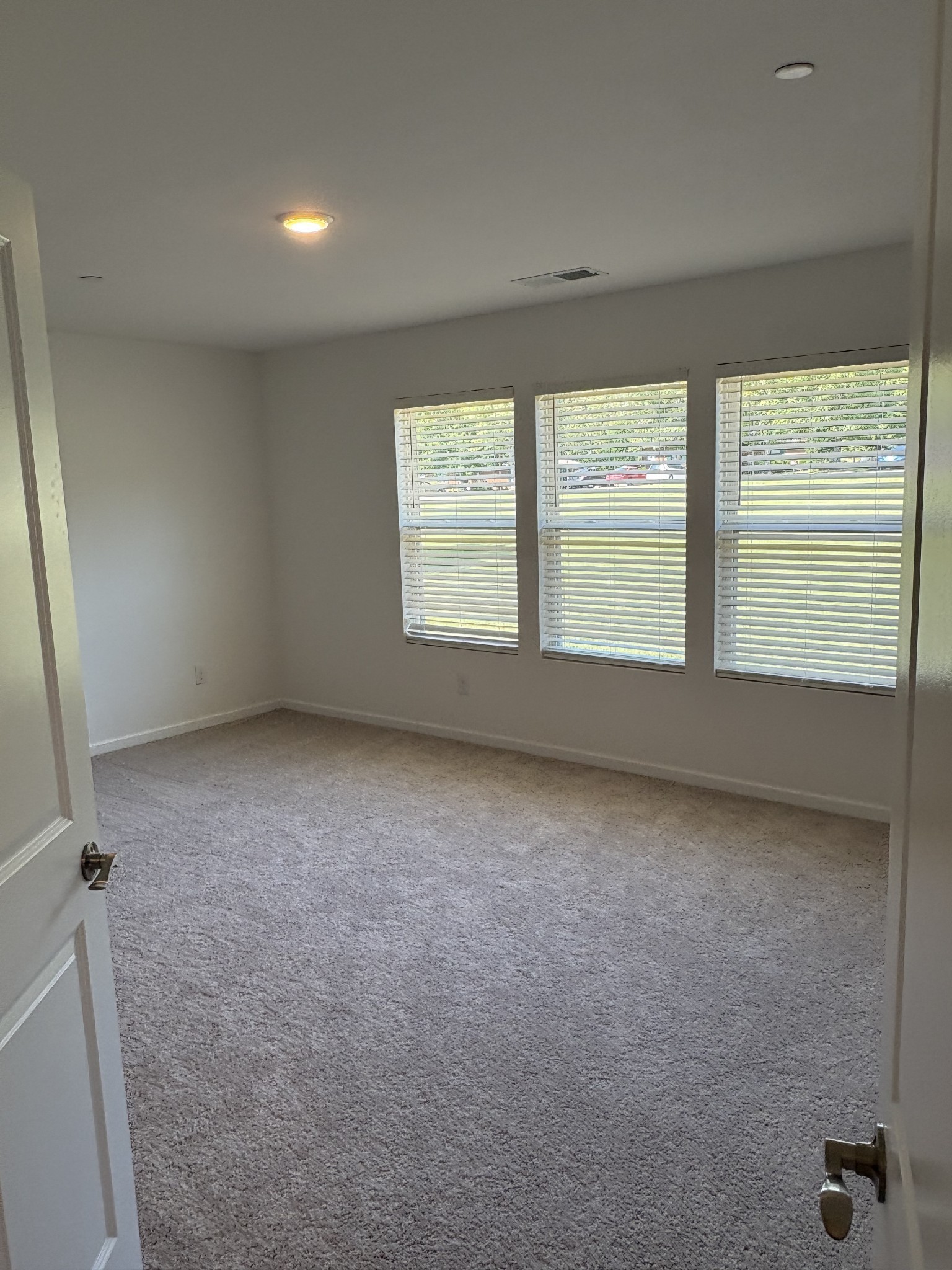 7144 Mapleside Lane, Unit 19 Fairview, TN 37062 - Photo 19 of 26 an empty room with a chair and a large window