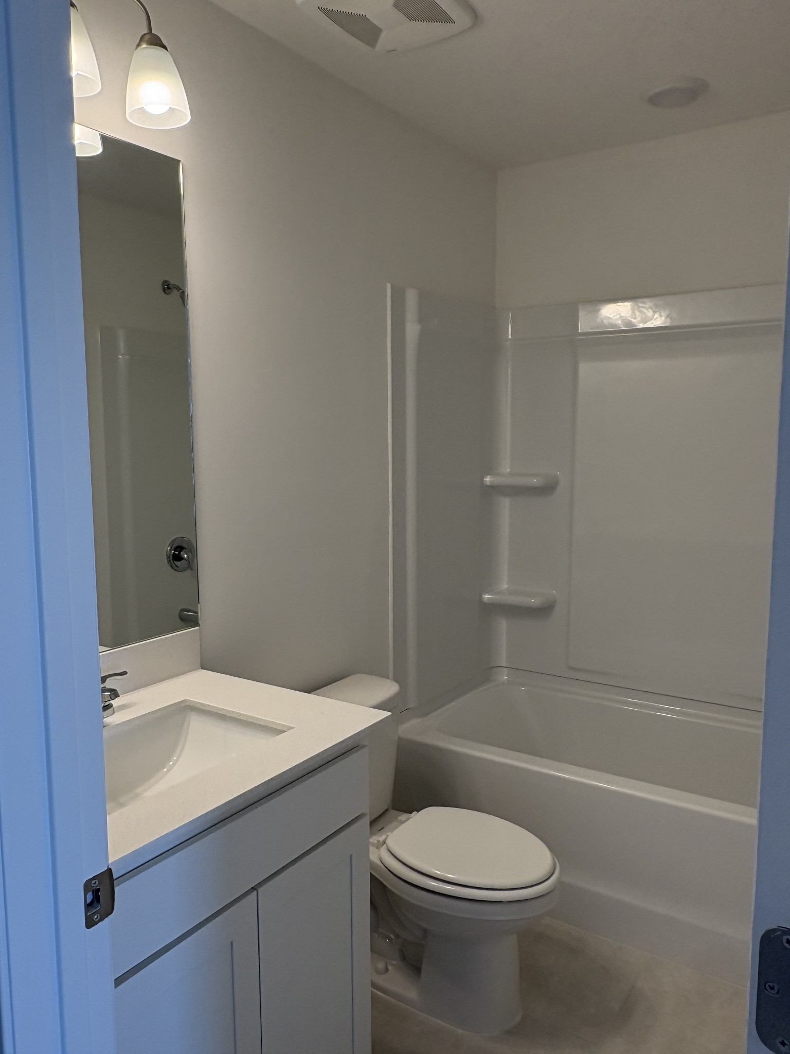7144 Mapleside Lane, Unit 19 Fairview, TN 37062 - Photo 23 of 26 a bathroom with a sink a toilet and shower