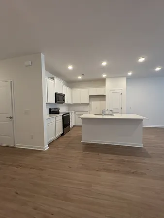 a view of kitchen with wooden floor