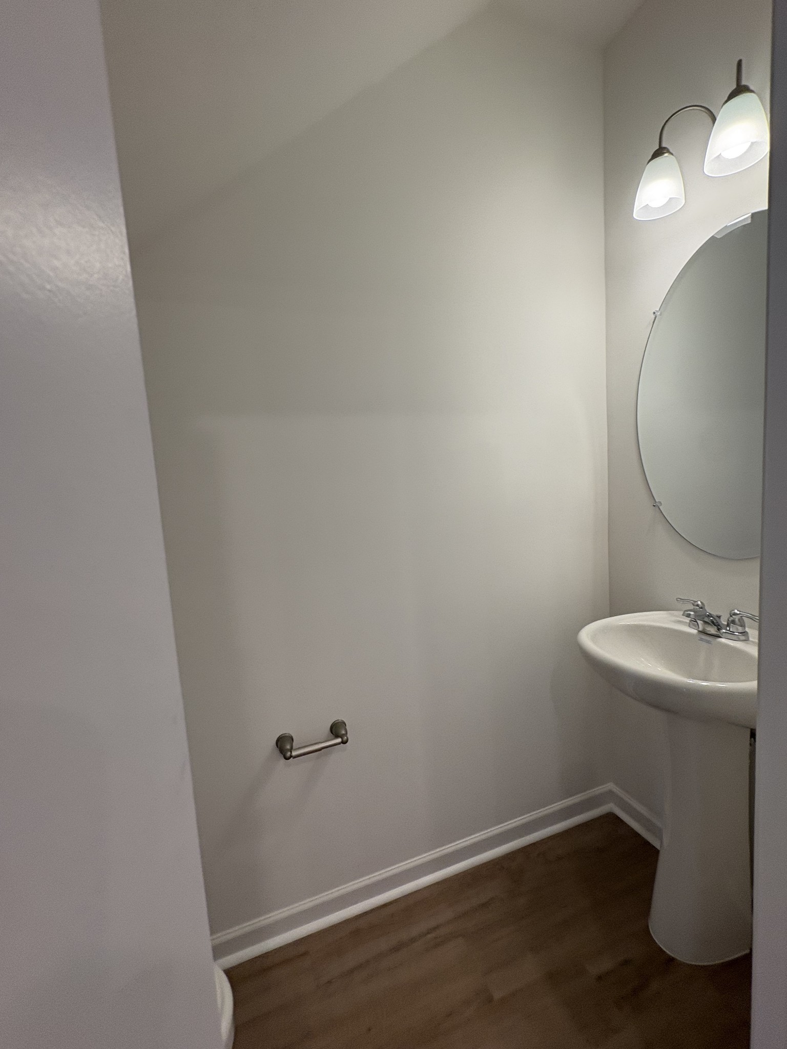 7144 Mapleside Lane, Unit 19 Fairview, TN 37062 - Photo 6 of 26 a bathroom with a sink and a mirror