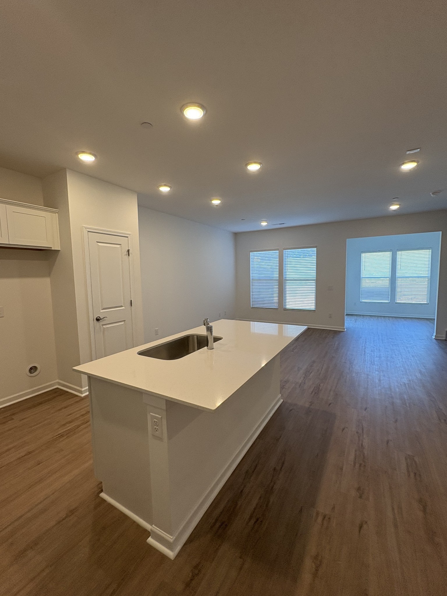 7144 Mapleside Lane, Unit 19 Fairview, TN 37062 - Photo 8 of 26 an empty room with wooden floor and windows