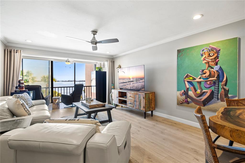 1602 Stickney Point Road, Unit 307 Sarasota, FL 34231 - Photo 13 of 56 a living room with furniture and a flat screen tv