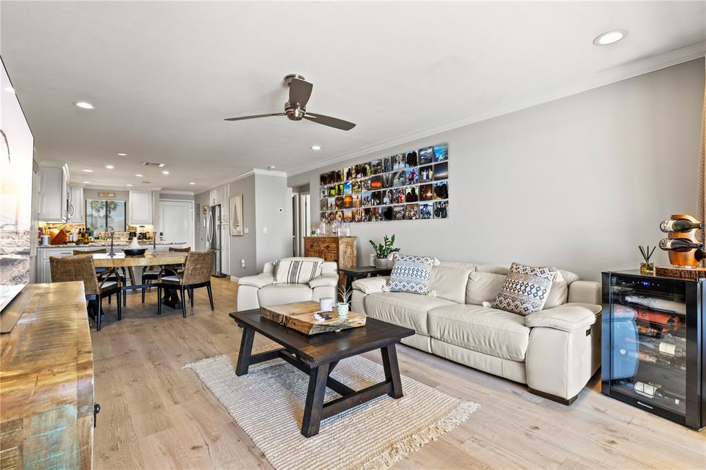 1602 Stickney Point Road, Unit 307 Sarasota, FL 34231 - Photo 15 of 56 a living room with furniture and a dining table with kitchen view