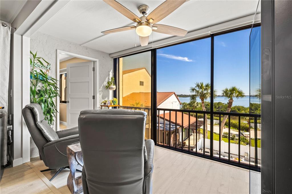 1602 Stickney Point Road, Unit 307 Sarasota, FL 34231 - Photo 19 of 56 a view of a porch with furniture