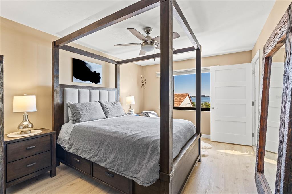 1602 Stickney Point Road, Unit 307 Sarasota, FL 34231 - Photo 23 of 56 a bedroom with a large bed and a window