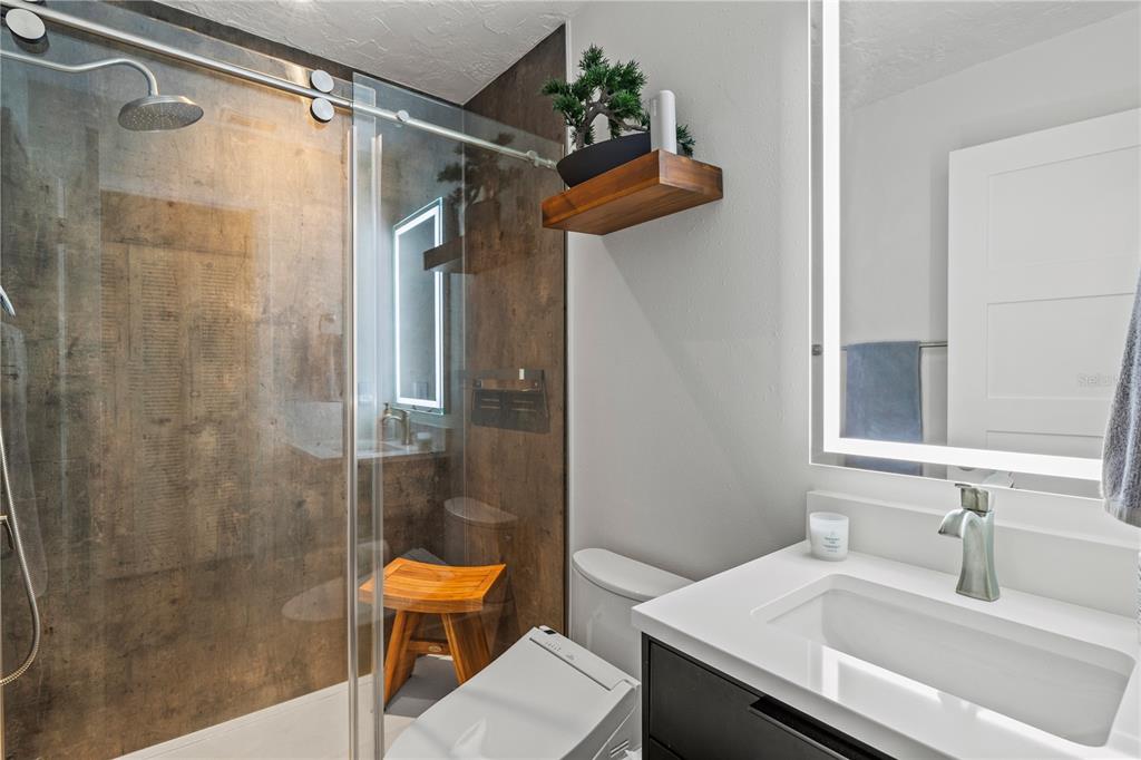 1602 Stickney Point Road, Unit 307 Sarasota, FL 34231 - Photo 27 of 56 a bathroom with a sink and a mirror