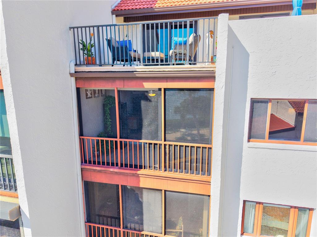 1602 Stickney Point Road, Unit 307 Sarasota, FL 34231 - Photo 30 of 56 a view of porch with a small yard