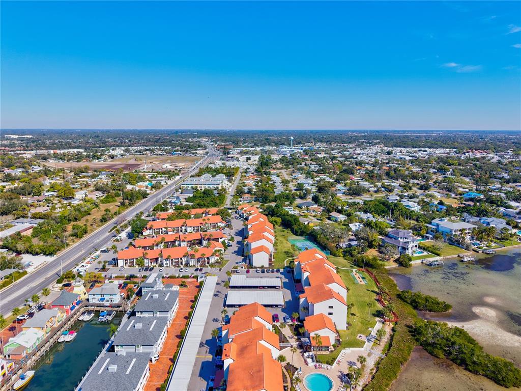 1602 Stickney Point Road, Unit 307 Sarasota, FL 34231 - Photo 39 of 56 an aerial view of residential building and ocean