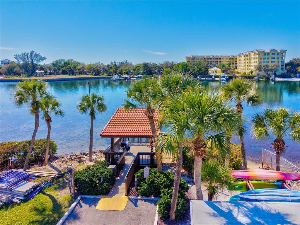 1602 Stickney Point Road, Unit 307 Sarasota, FL 34231 - Photo 47 of 56 an aerial view of a house with outdoor space and lake view in back