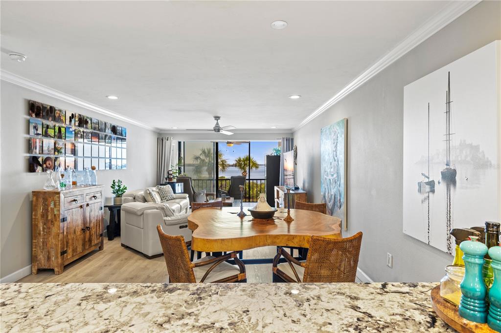 1602 Stickney Point Road, Unit 307 Sarasota, FL 34231 - Photo 9 of 56 a living room with furniture a rug and a table