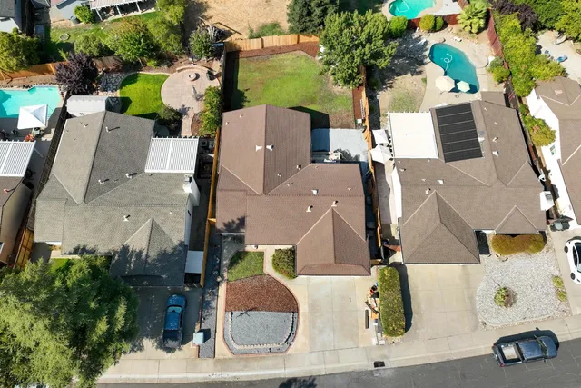 an aerial view of residential houses with outdoor space