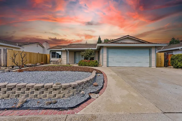 a front view of a house with yard