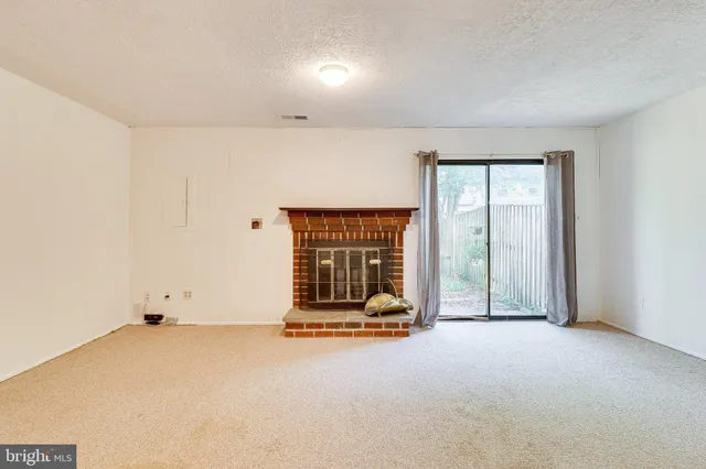 a view of a house with a fence