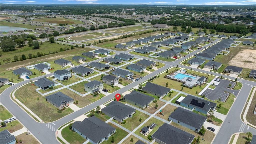 9329 Southwest 57th Terrace Ocala, FL 34476 - Photo 58 of 64 an aerial view of residential houses with outdoor space