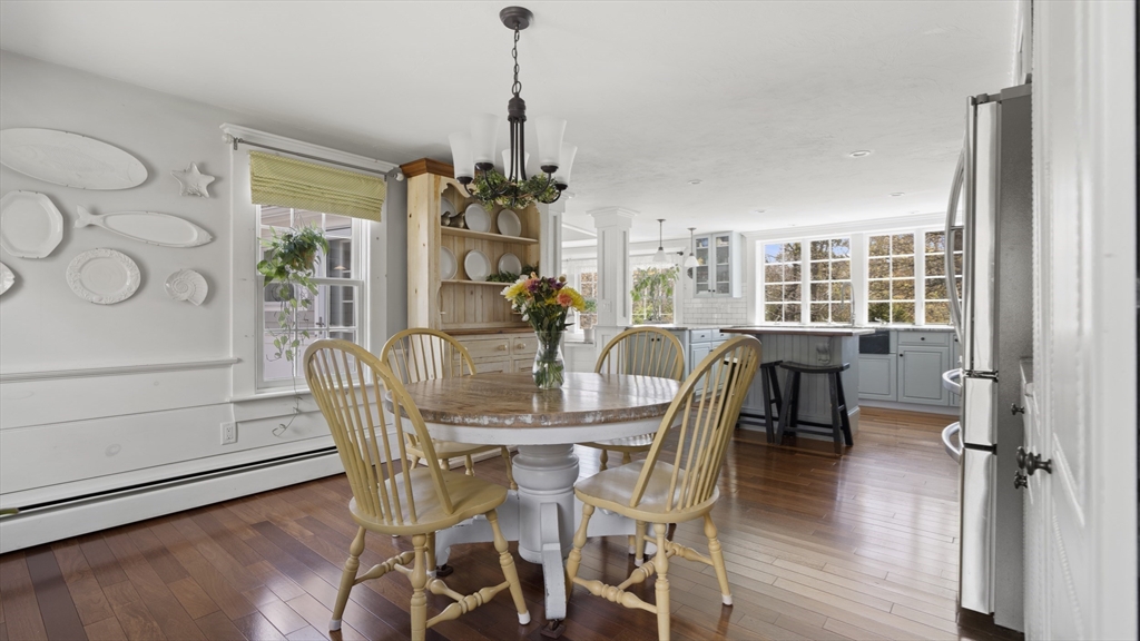 29 Back River Road Bourne, MA 02532 - Photo 11 of 37 a view of a dining room with furniture window and wooden floor
