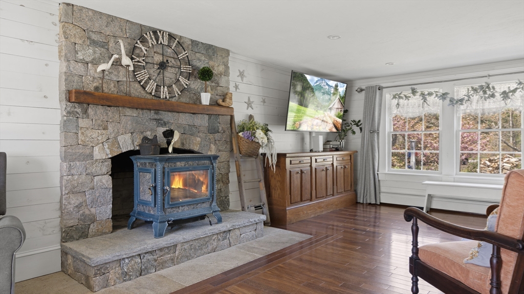 29 Back River Road Bourne, MA 02532 - Photo 13 of 37 a living room with furniture and a fireplace