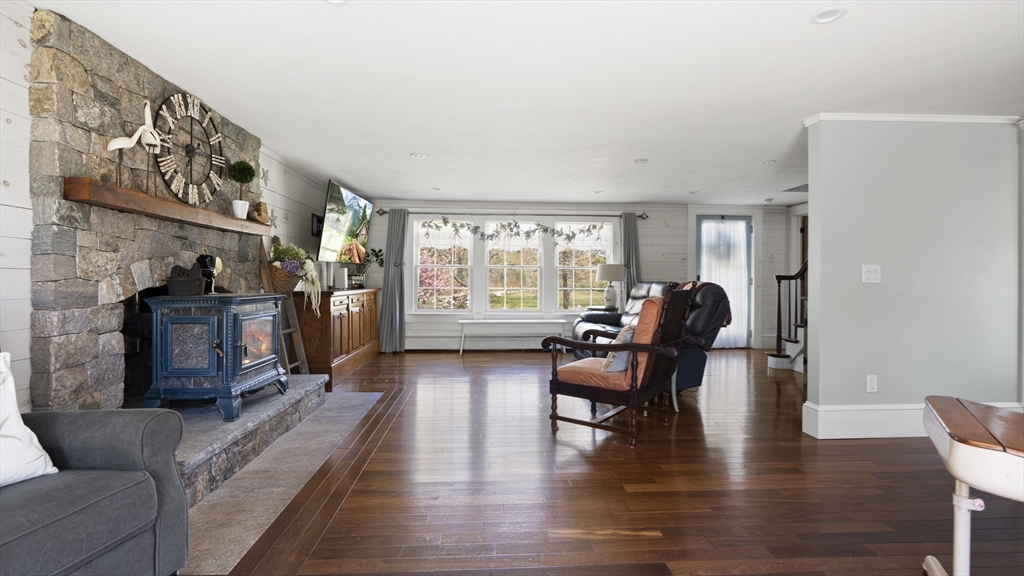 29 Back River Road Bourne, MA 02532 - Photo 15 of 37 a living room with furniture and a wooden floor