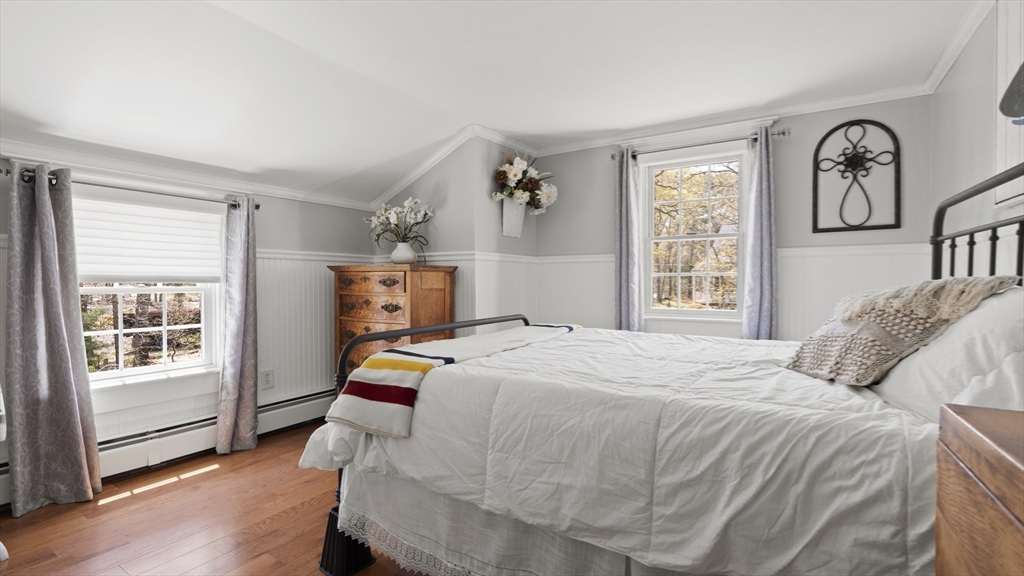 29 Back River Road Bourne, MA 02532 - Photo 27 of 37 a bedroom with a bed a large window with wooden floor