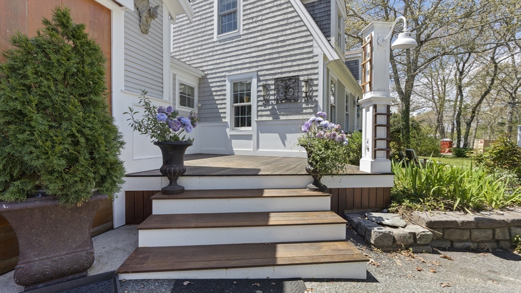29 Back River Road Bourne, MA 02532 - Photo 5 of 37 a view of a house with a fountain