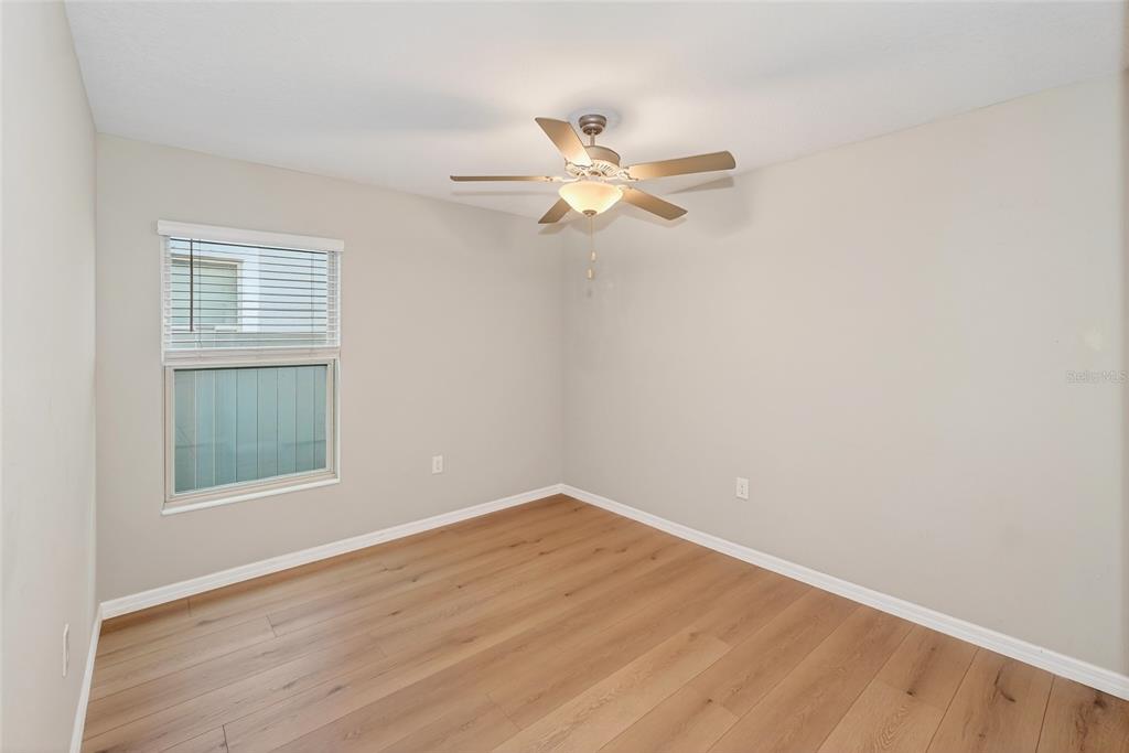16751 Delia Street Wimauma, FL 33598 - Photo 17 of 36 an empty room with a window and a fan