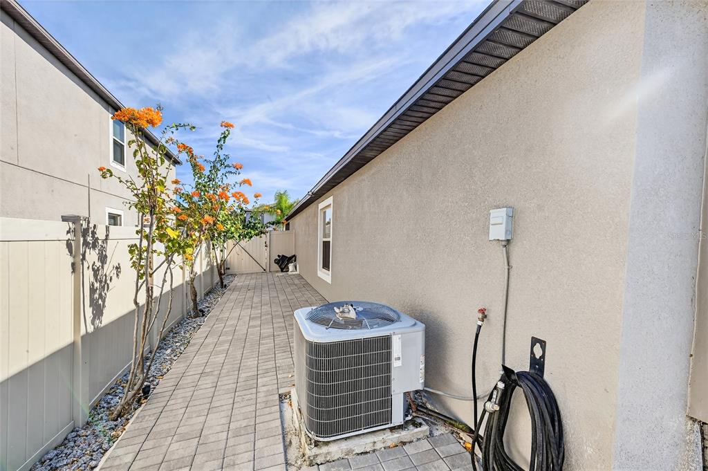 16751 Delia Street Wimauma, FL 33598 - Photo 27 of 36 a view of a hallway with wooden floor and a potted plant