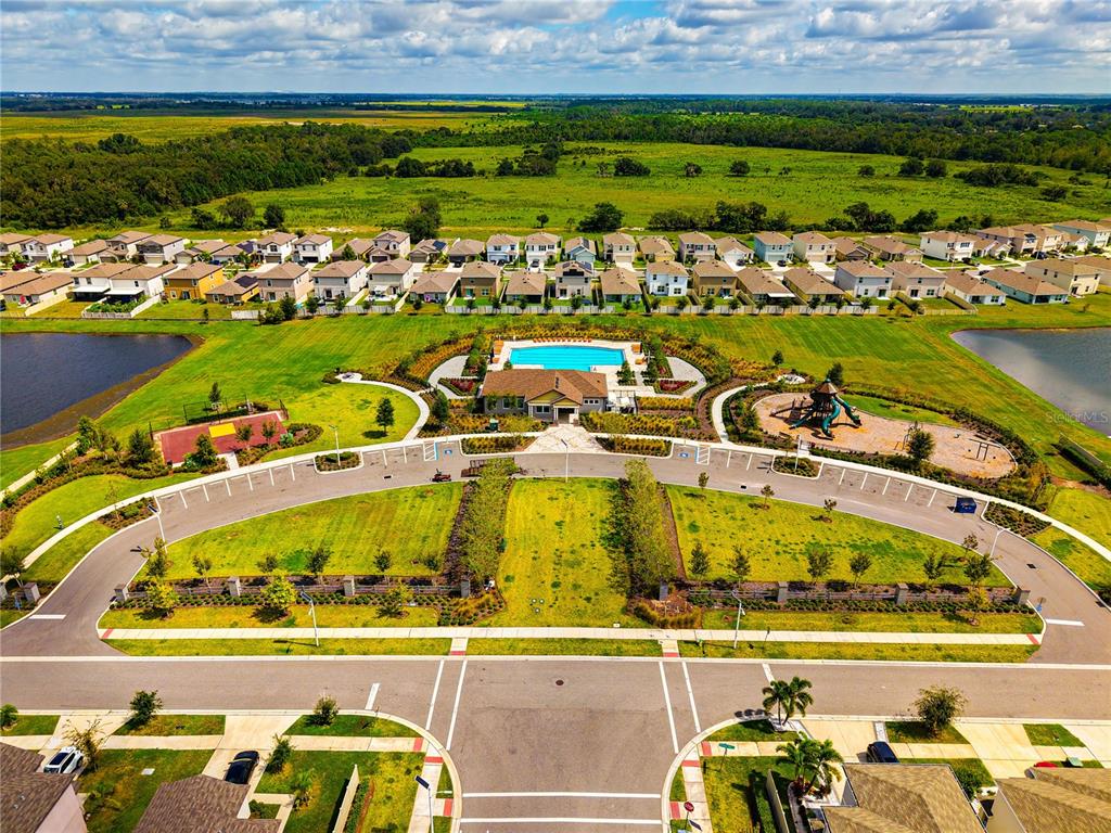 16751 Delia Street Wimauma, FL 33598 - Photo 32 of 36 an aerial view of a residential building with outdoor space