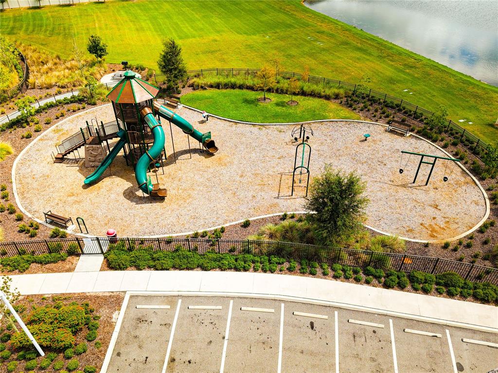 16751 Delia Street Wimauma, FL 33598 - Photo 34 of 36 an aerial view of a house with a swimming pool