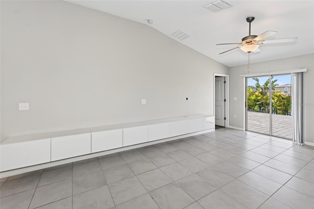 16751 Delia Street Wimauma, FL 33598 - Photo 6 of 36 a view of an empty room with a window