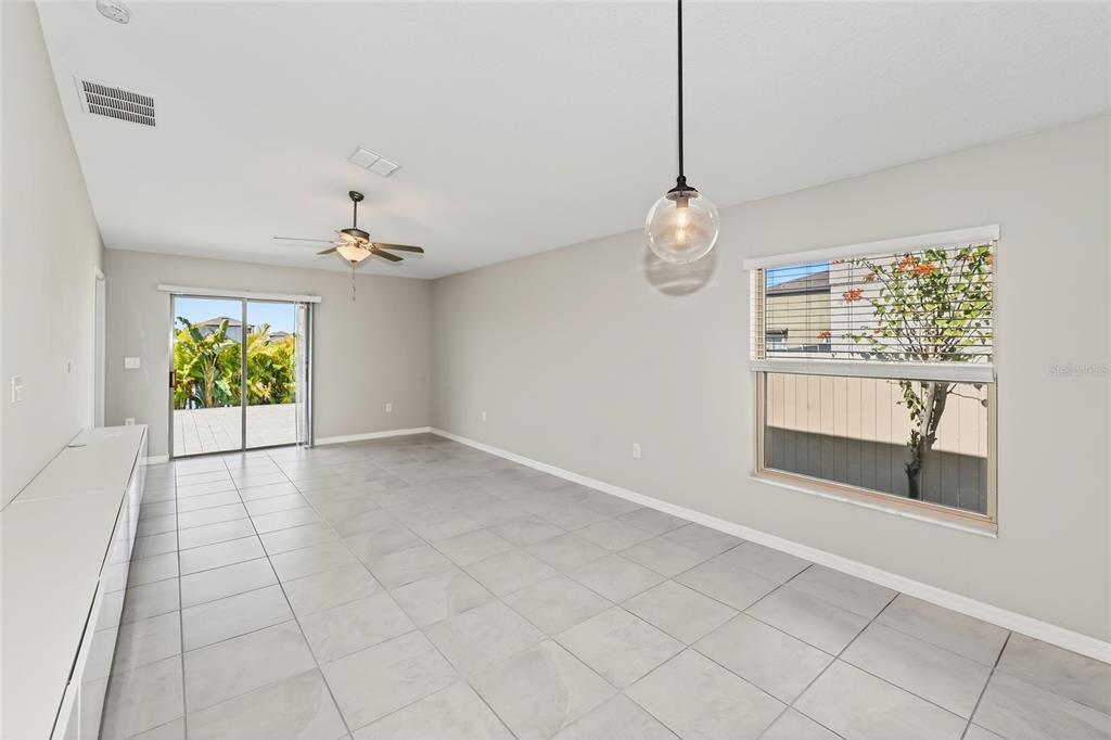 16751 Delia Street Wimauma, FL 33598 - Photo 7 of 36 a view of an empty room with a window