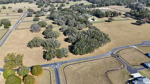 an aerial view of a house having yard