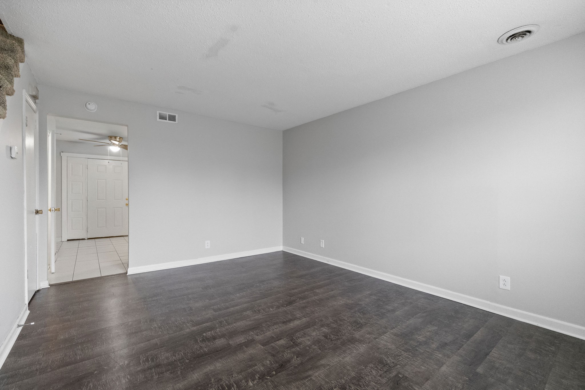 1231 State Line Road, Unit 45 Oak Grove, KY 42262 - Photo 6 of 16 a view of an empty room and wooden floor