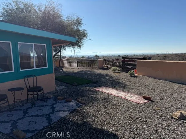 a view of a balcony with wooden floor