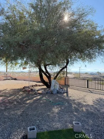 a view of a backyard of the house