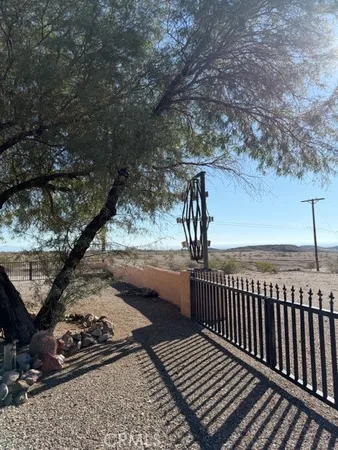 a living room with furniture and a ceiling fan