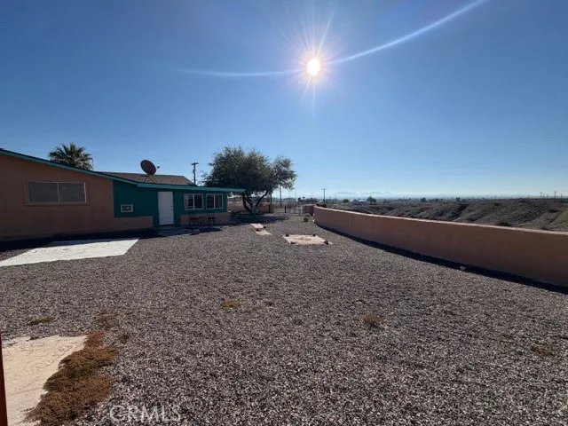 a living room with furniture and flowers