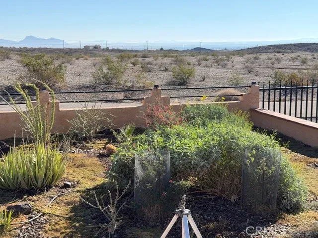 a living room with furniture and a ceiling fan