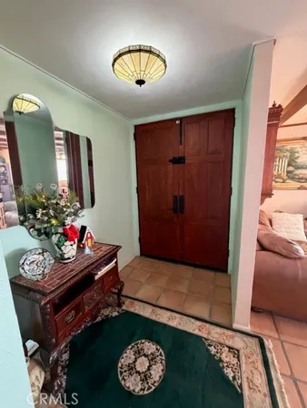 a room with lots of furniture and a rug