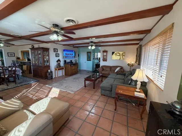 a kitchen with stainless steel appliances granite countertop a sink a stove a microwave a refrigerator a microwave and cabinets