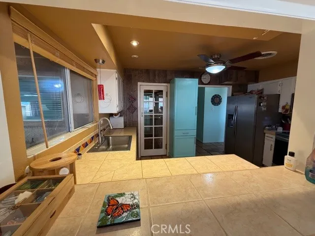 a bedroom with furniture and a flat screen tv