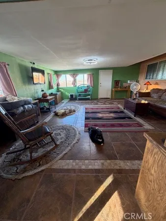 a bathroom with a granite countertop toilet sink and mirror