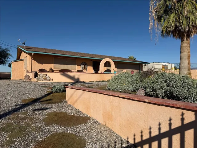 a view of a house with a snow on the road